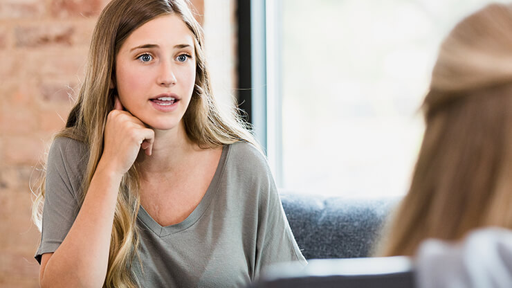 Two female students in discussion